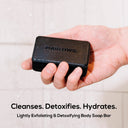 Marlowe charcoal exfoliating soap bar with natural ingredients and cleansing properties, shown with the soap bar on a white background.