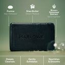 MARLOWE. charcoal exfoliating soap bar with natural ingredients, featuring a dark charcoal-colored bar on a clean surface.