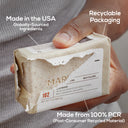 Marlowe Oud Wood scrub soap bar in packaging, featuring natural ingredients and a rich oud wood fragrance.