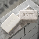 Danny MARLOWE Butt Face Dual Sided Soap Bar for shower use, featuring a unique design with two different cleansing sides.